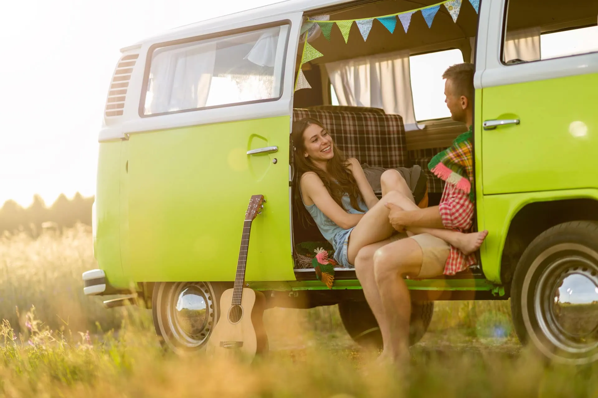 Couple camping in VW Van